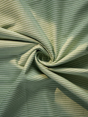 Close-up of green striped fabric with a swirl pattern