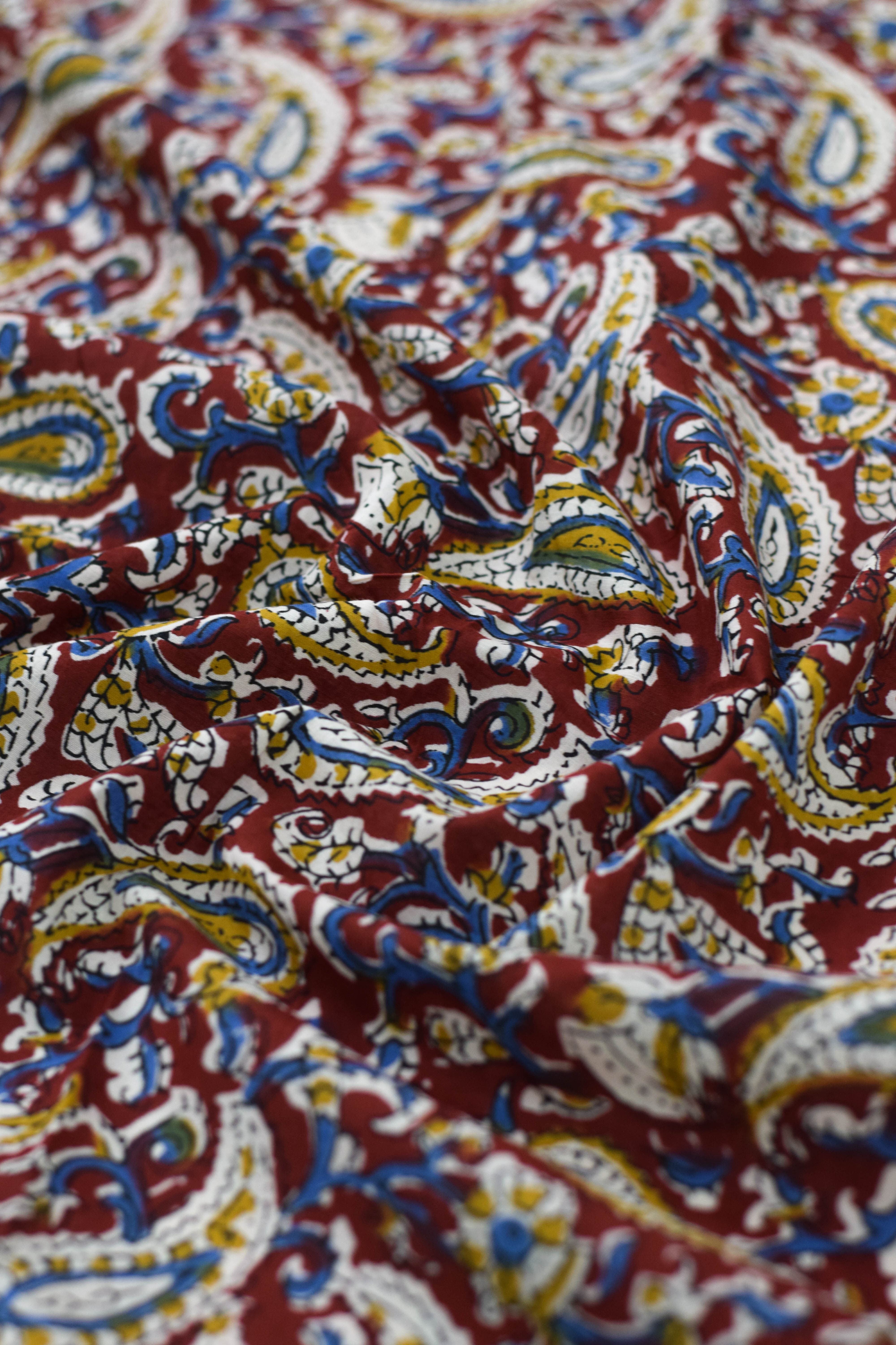 Close-up of colorful paisley patterned fabric.