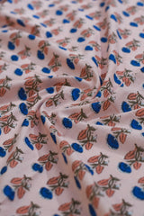 Close-up of floral patterned fabric with pink background