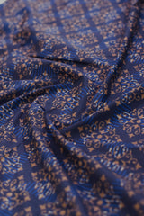 Blue fabric with intricate gold patterns