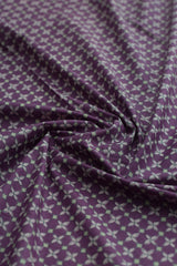 Purple fabric with subtle pattern close-up