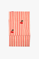 Red and white striped towel with cherry designs on a white background