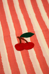 Embroidered cherries on a red and white striped fabric