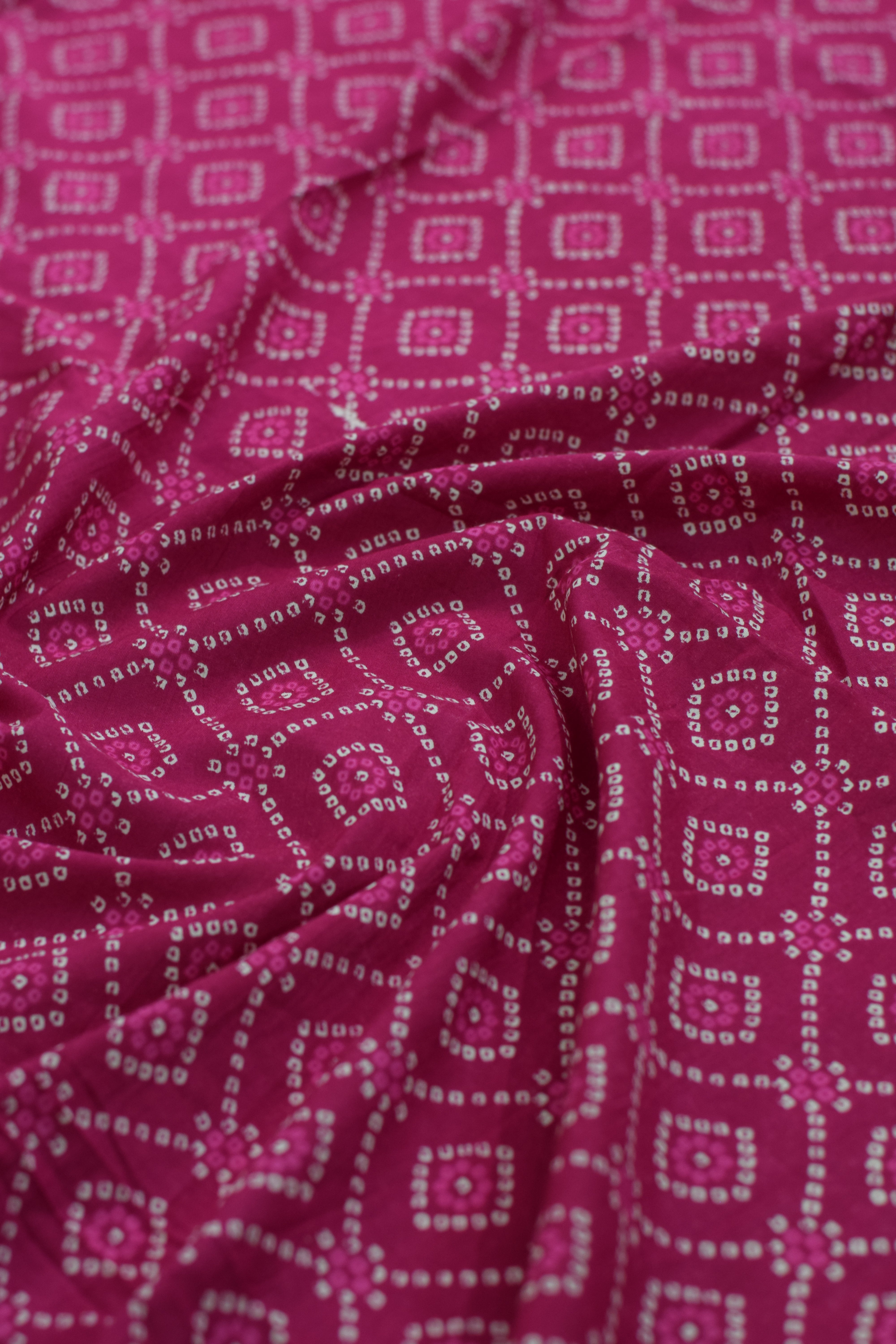 Close-up of pink fabric with diamond pattern