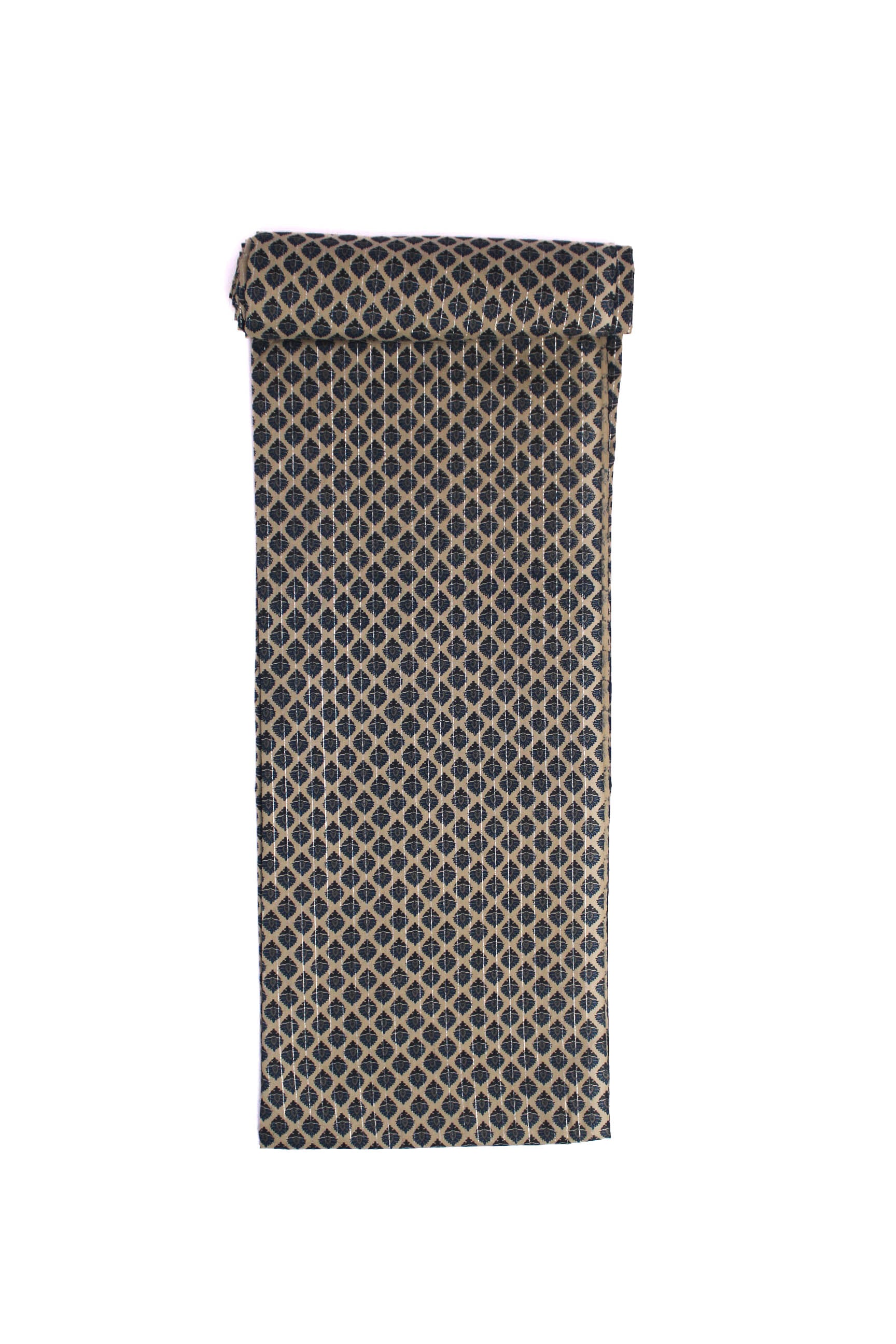 A swatch of fabric featuring a repeating indigo block-printed booti pattern on a beige canvas.