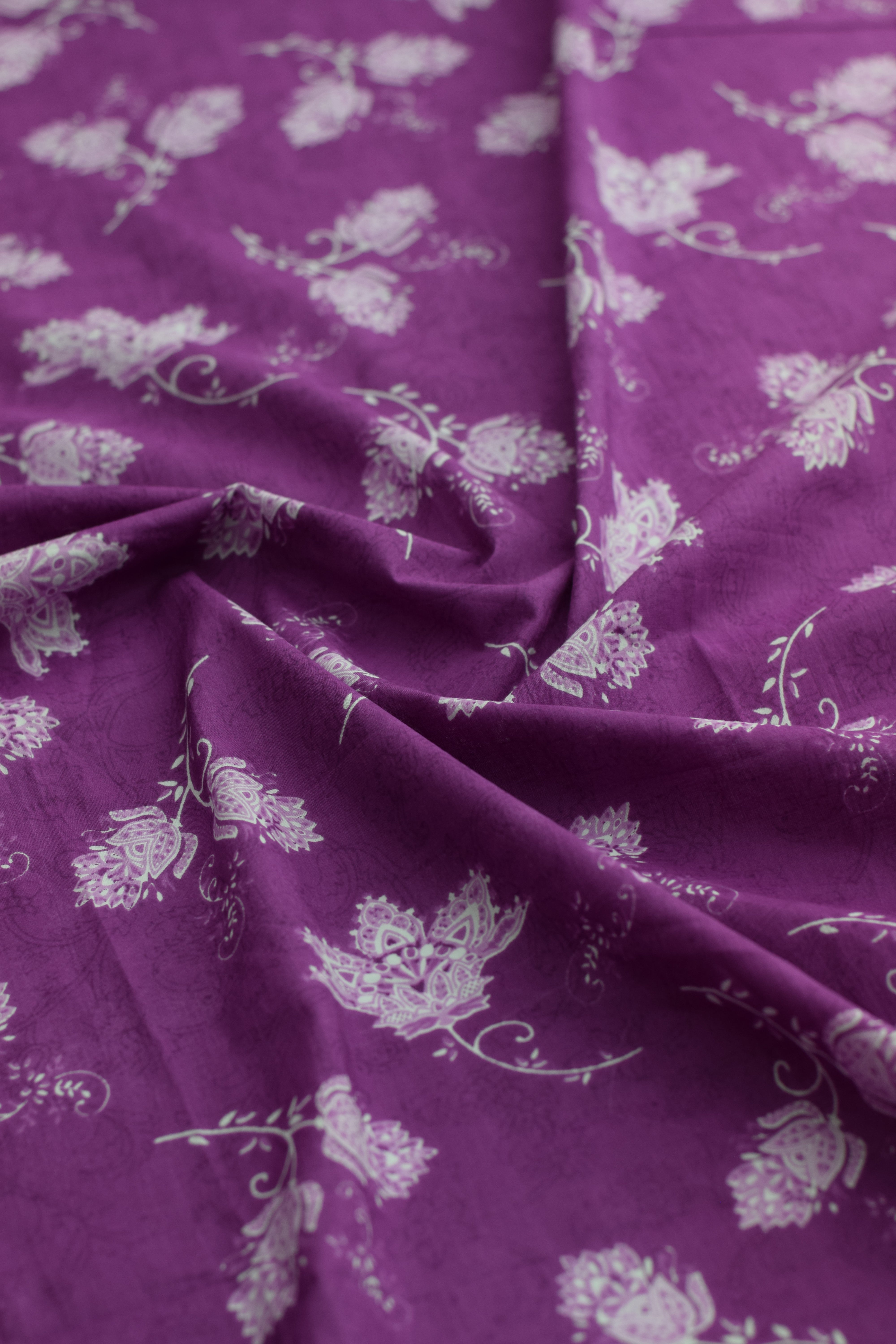 Purple fabric with white floral patterns