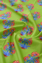 Green fabric with orange and blue floral patterns