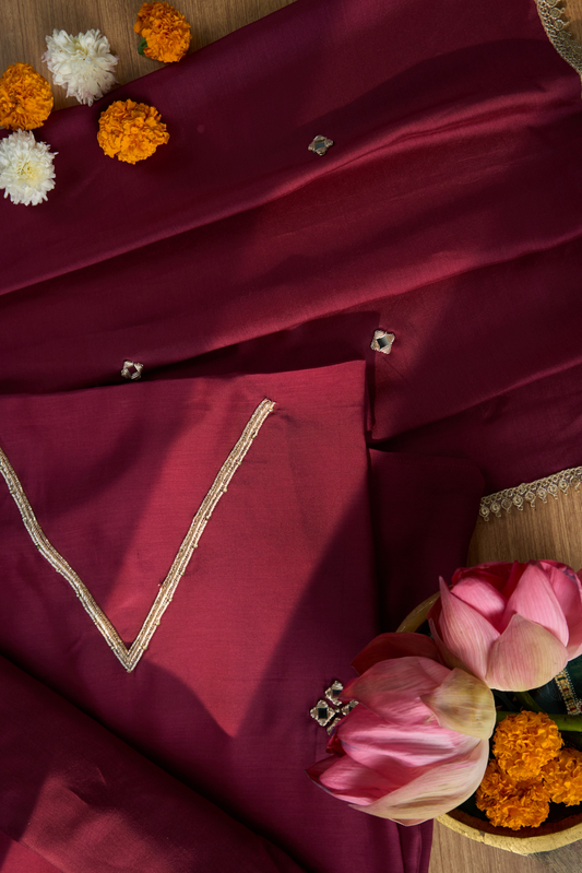 Maroon fabric with gold embroidery