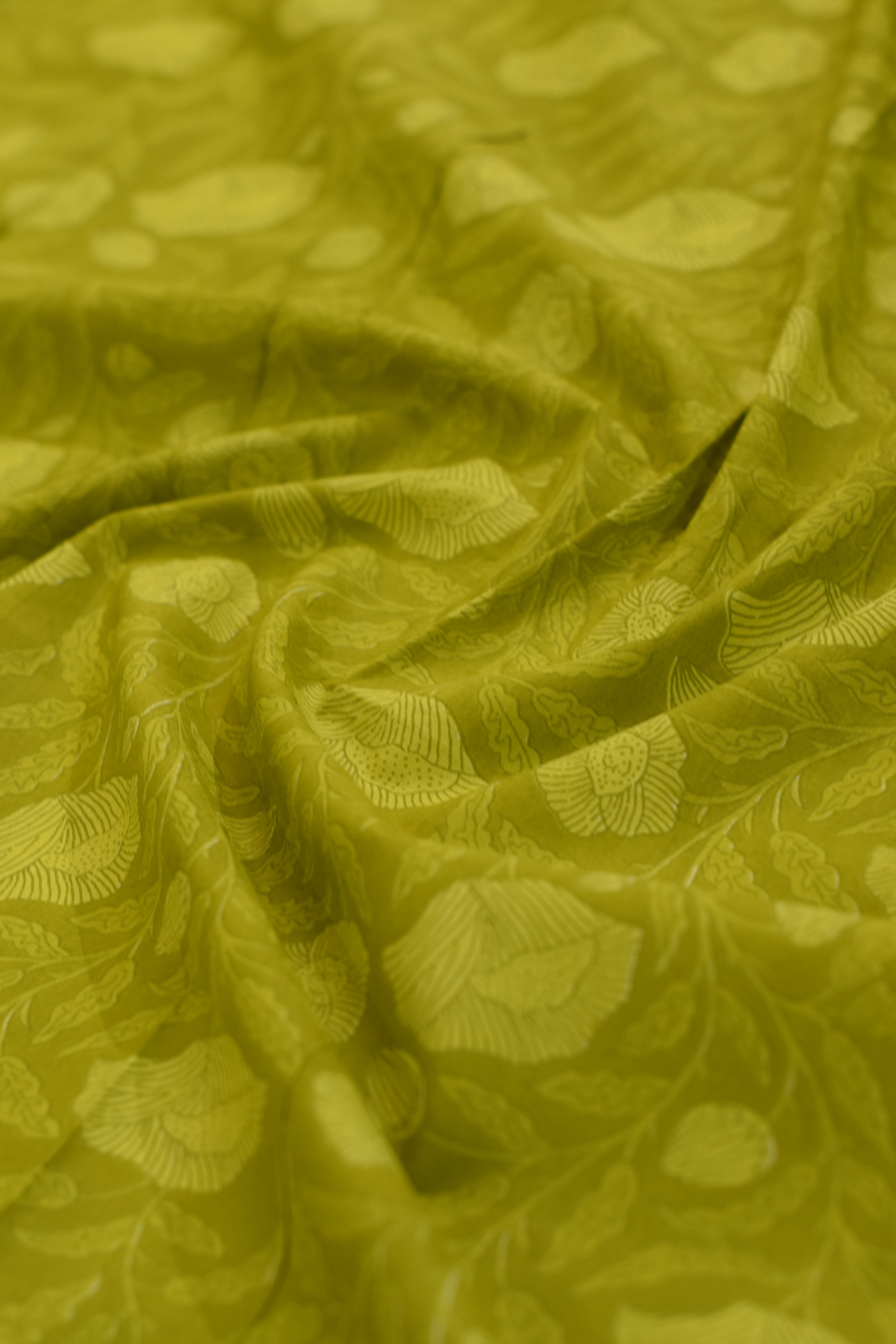Close-up of green fabric with leaf pattern