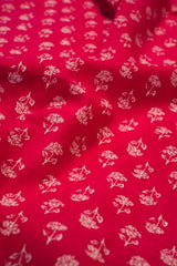 Red fabric with white floral pattern