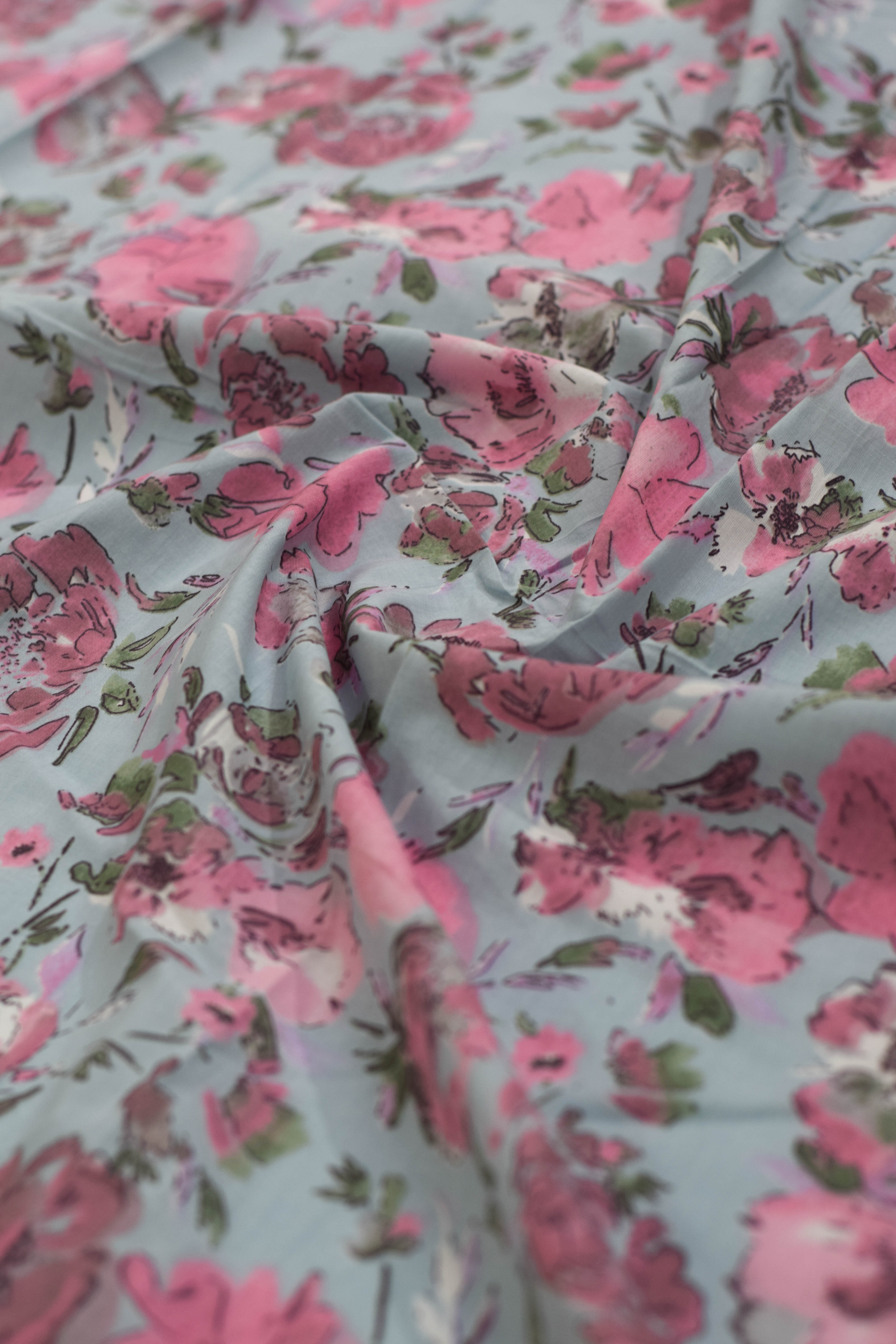 Floral patterned fabric with pink and green colors.