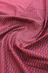 Red fabric with blue zigzag pattern