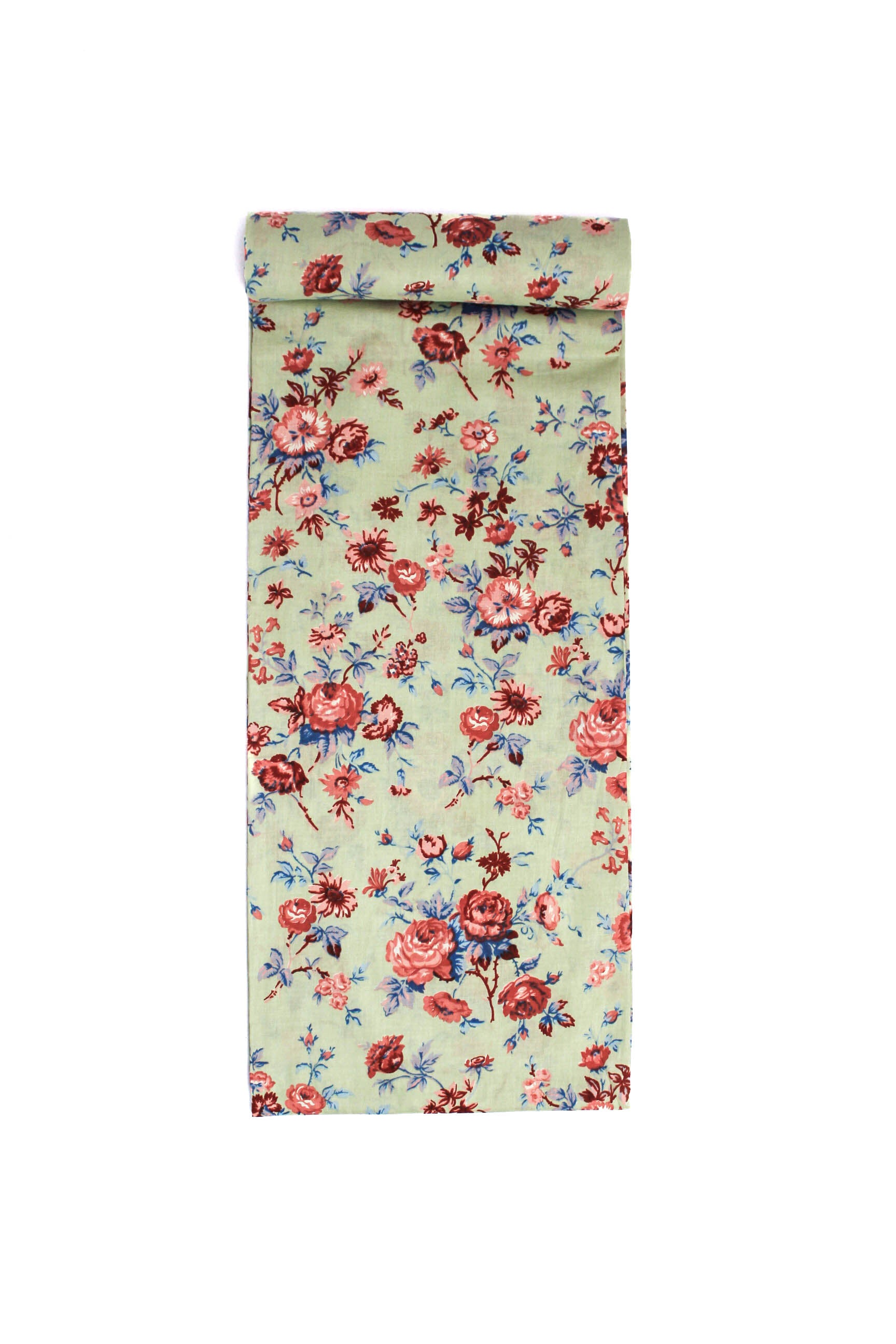 Fabric with a rustic floral pattern featuring pink, red, and blue flowers on a cream-colored background