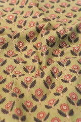 Floral patterned fabric with red and black flowers on a olive background