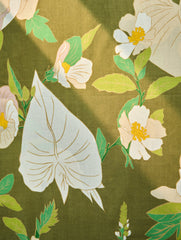 Floral pattern with large leaves and flowers on a olive background