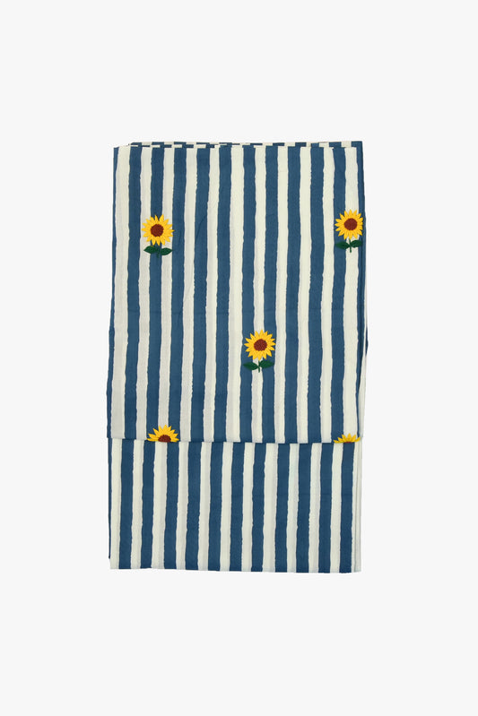 Striped fabric with sunflower designs on a white background