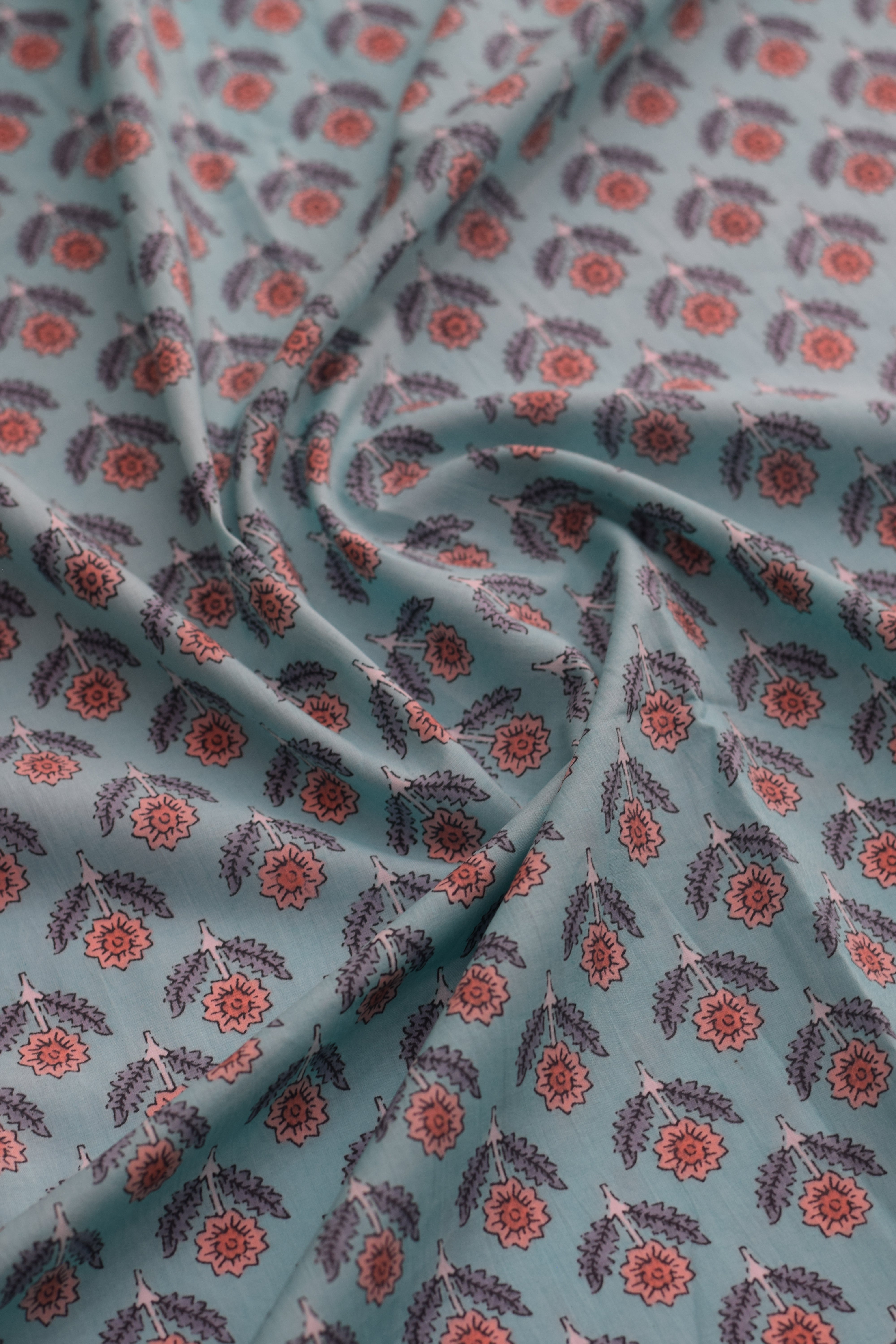 Floral patterned fabric with blue background