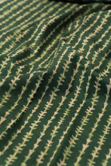 Close-up of green fabric with a subtle pattern