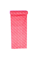 A rolled piece of fabric with a red and white swirl pattern.
