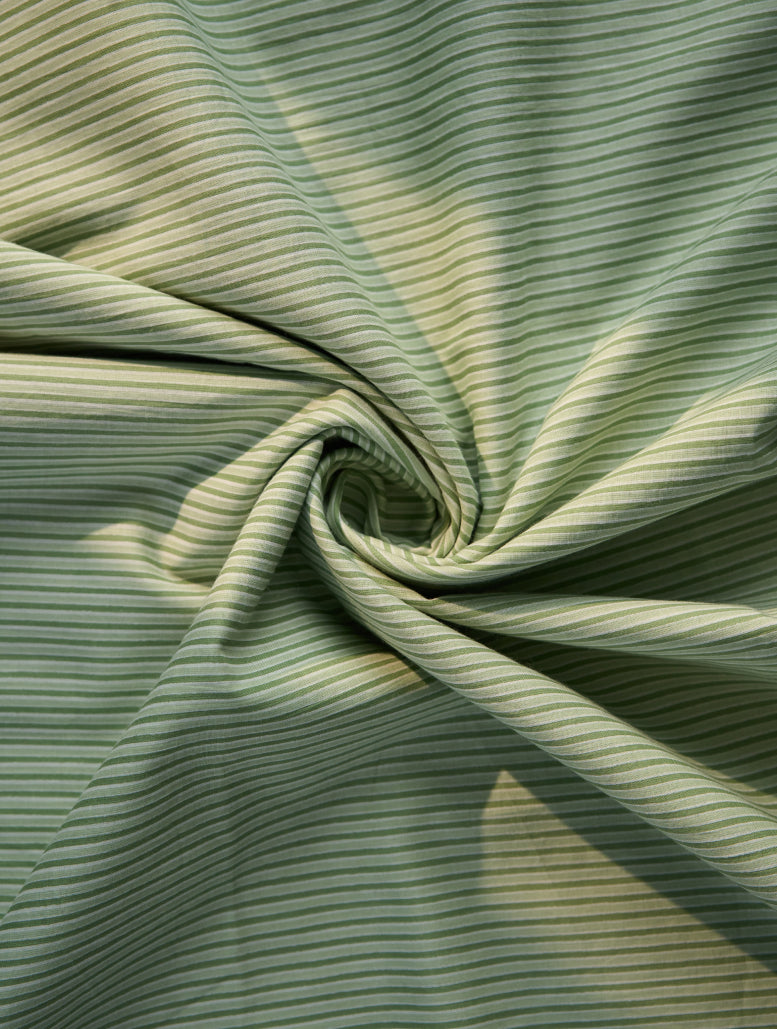 Close-up of green striped fabric with a swirl pattern