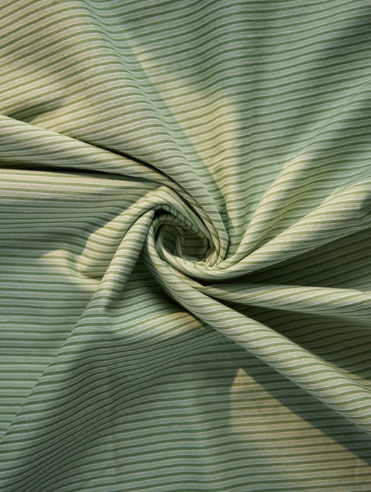 Close-up of green striped fabric with a swirl pattern