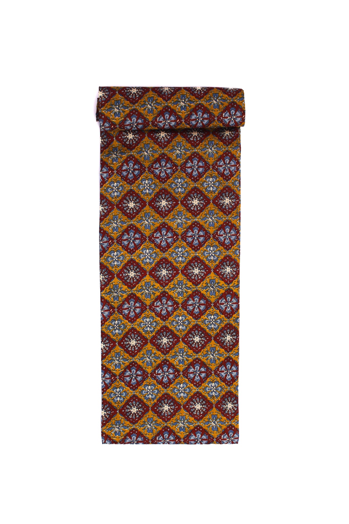 Fabric with a floral medallion pattern in red, blue, and gold on a mustard base.