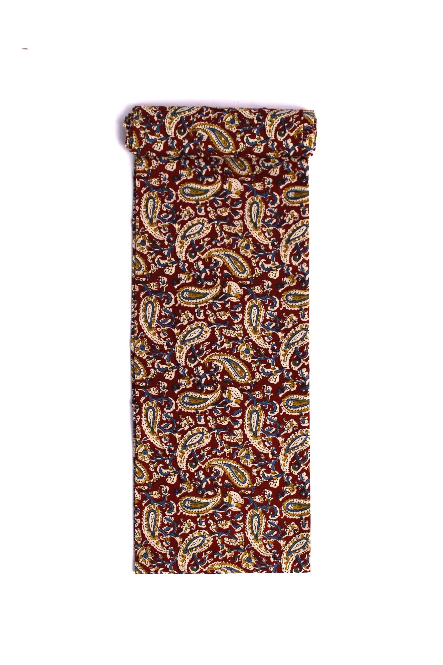Fabric featuring a maroon scroll pattern with paisleys and floral elements on a cream background.