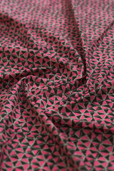 Pink and black geometric patterned fabric.