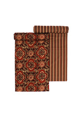 Two suits hanging, one with a floral pattern and another with a geometric zigzag pattern, both in earthy tones.
