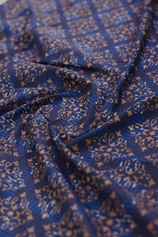 Blue fabric with intricate gold patterns