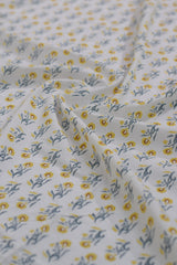 Fabric with yellow floral pattern on white background