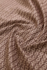 Close-up of fabric with triangle pattern in brown and beige.