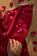 maroon fabric with gold trim
