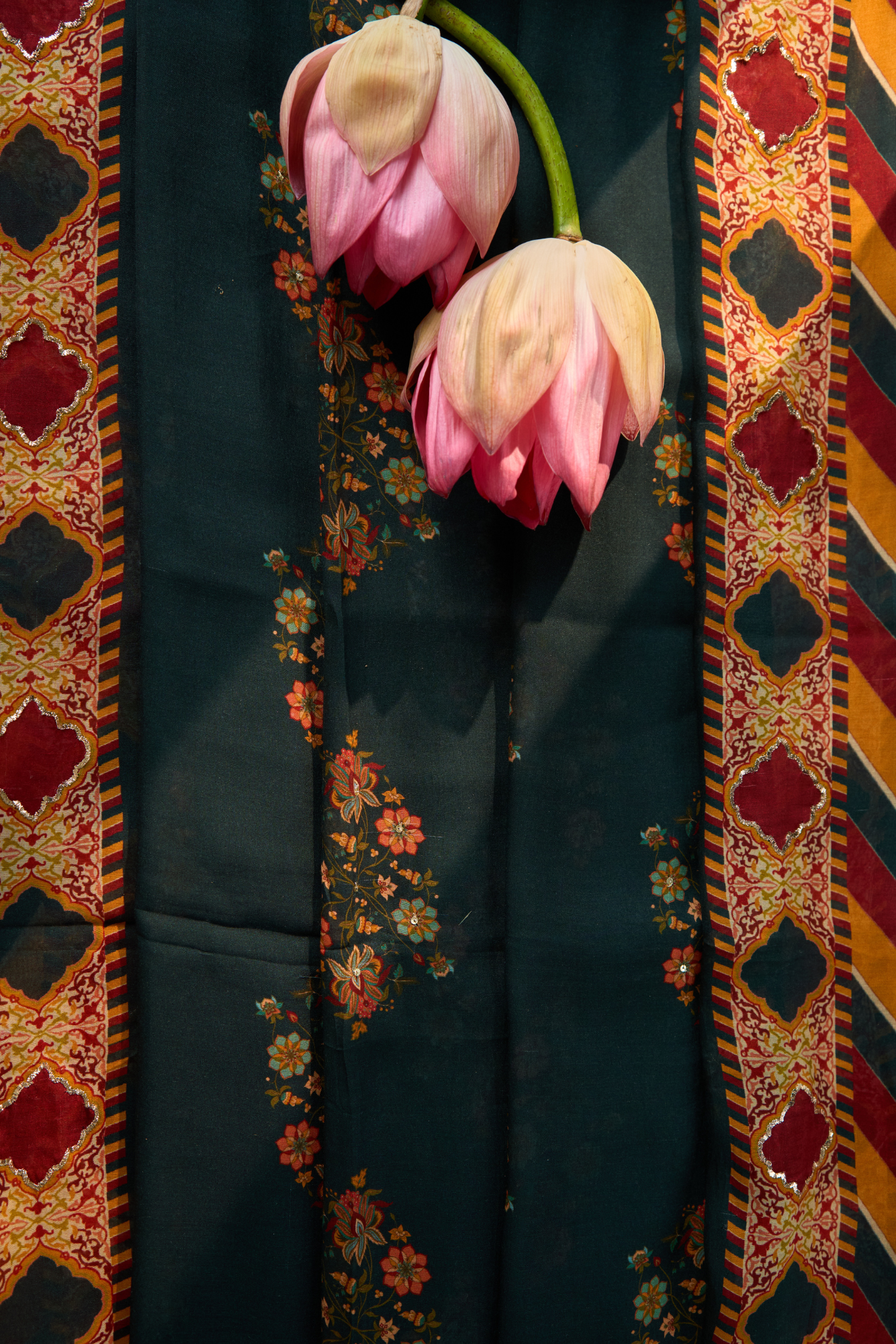 Green dark fabric with intricate patterns