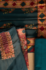 Close-up of embroidered fabric with intricate patterns and colors.