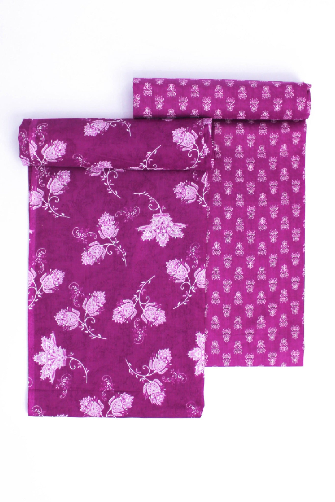 A two-piece suit set with one piece displaying a purple floral pattern on a lighter purple background and the other piece with a small, geometric purple pattern.