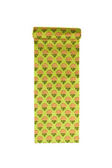Fabric with a lush green base featuring vibrant orange and yellow marigold patterns.