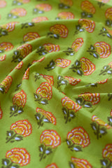 Close-up of floral patterned fabric on a green background