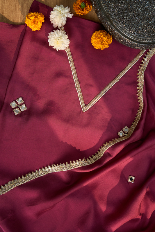 Maroon fabric with gold embroidery