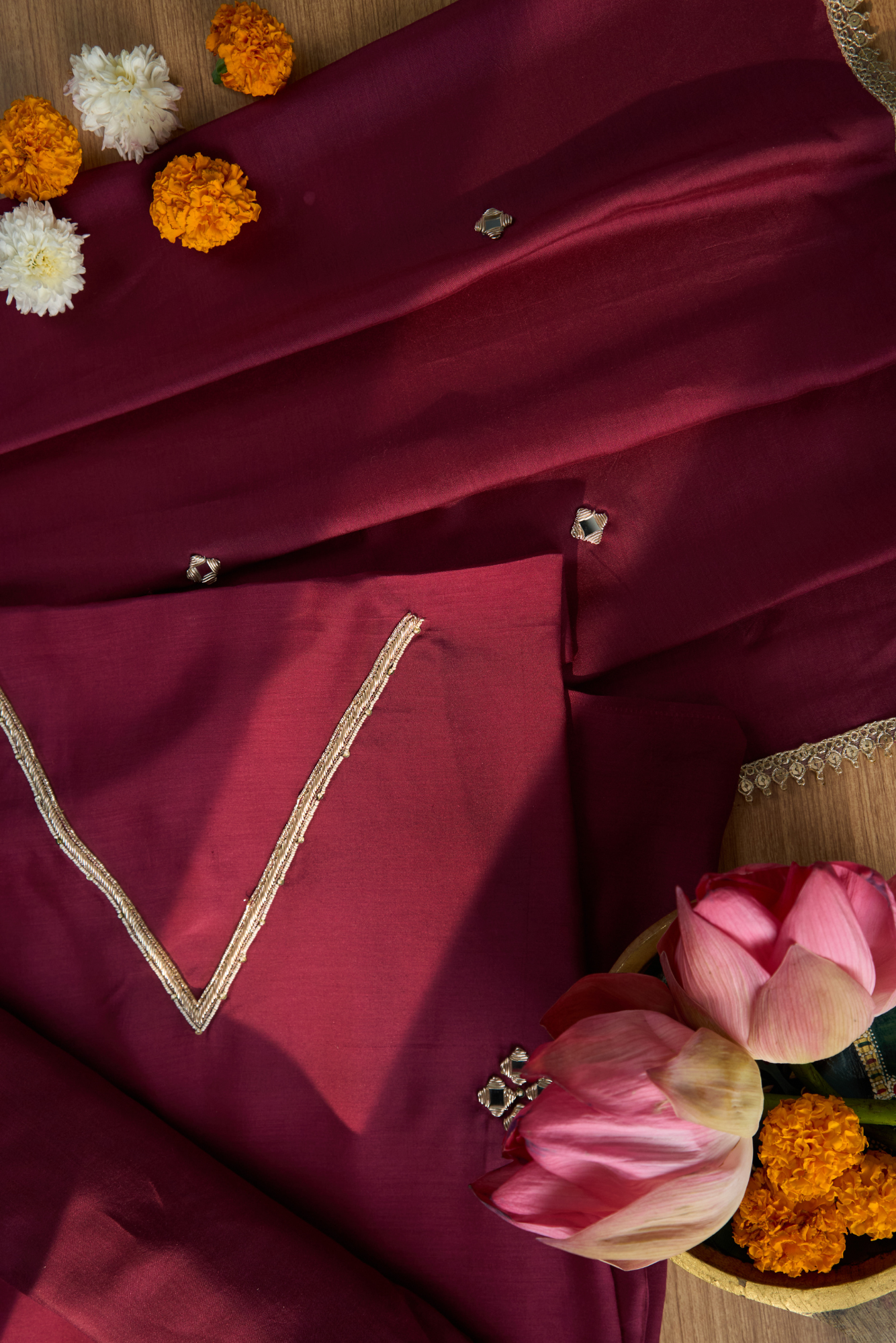 Maroon fabric with gold embroidery 