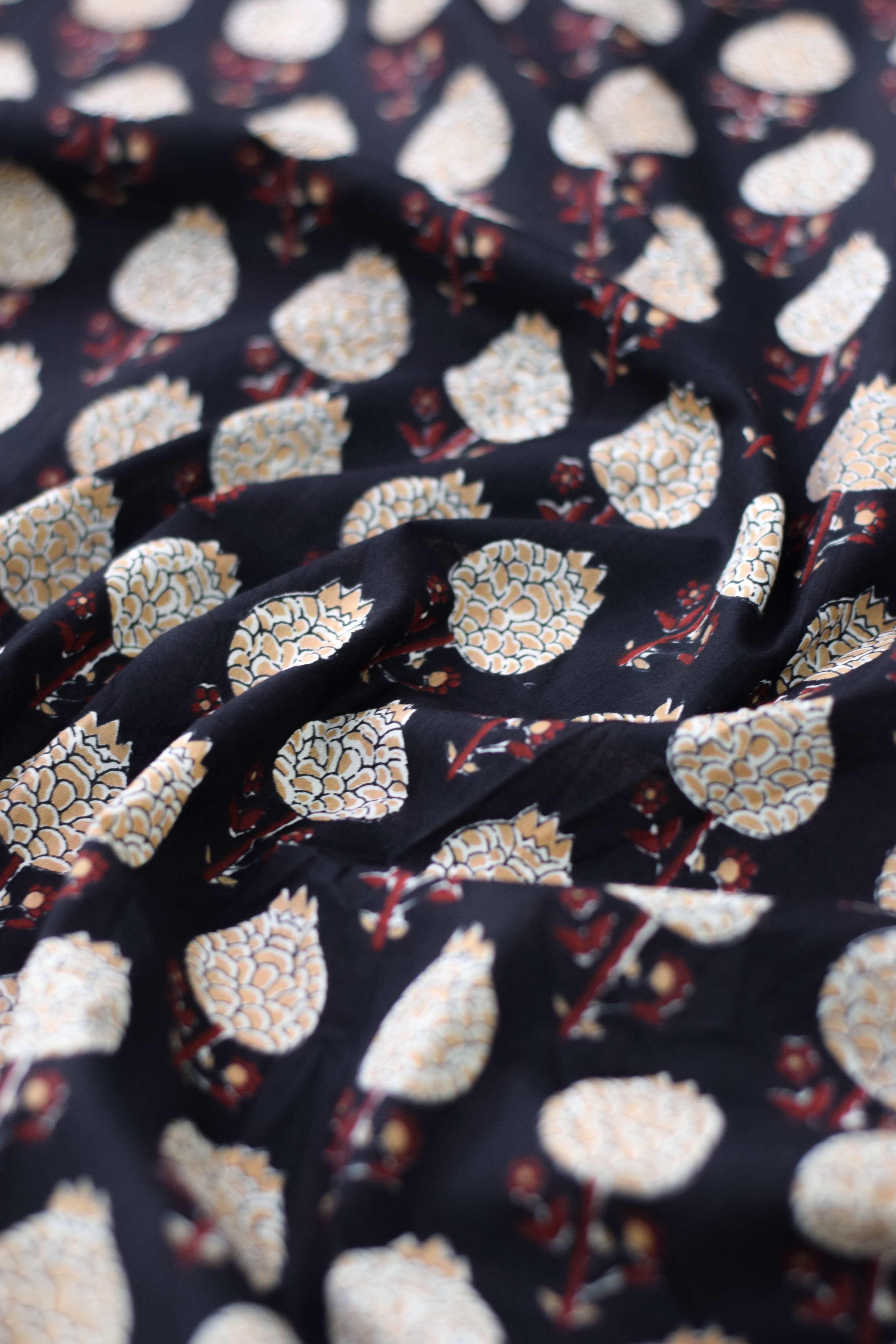 Close-up of fabric with intricate pattern on dark background