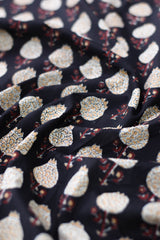 Close-up of fabric with intricate pattern on dark background