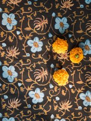 Decorative fabric with floral patterns on a dark background