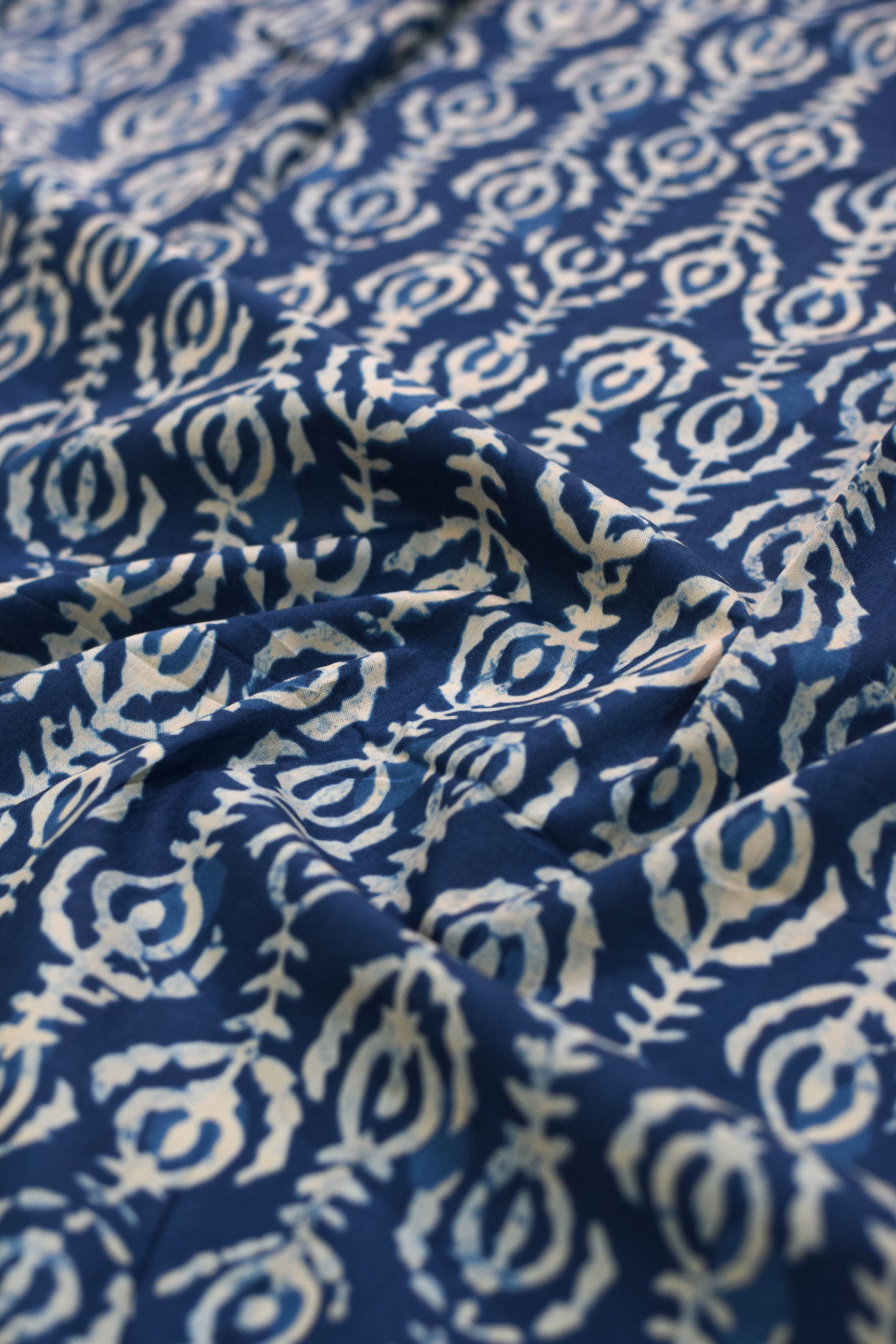 Blue fabric with white patterned design