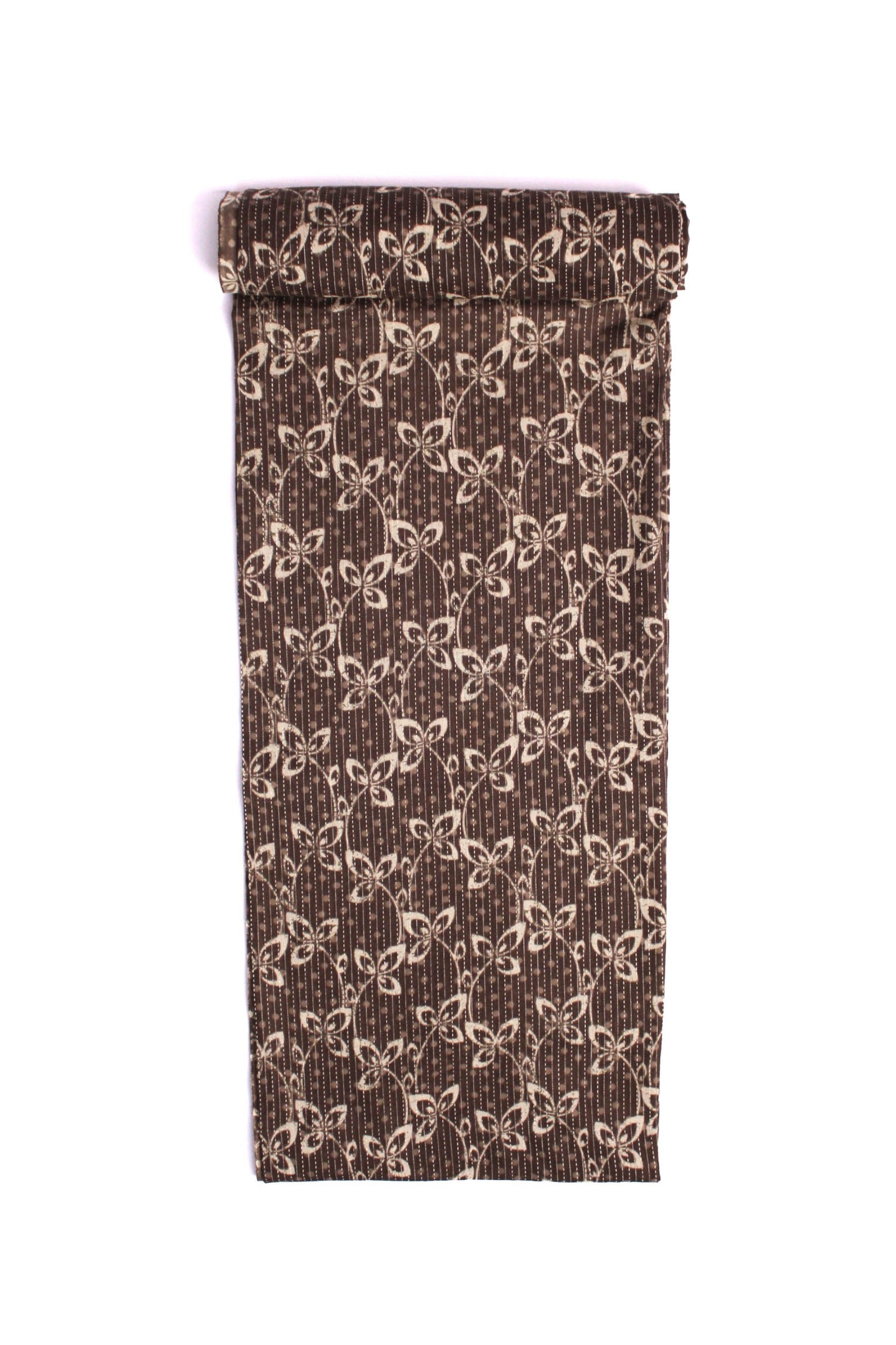 Fabric with a charcoal grey base featuring a delicate white floral pattern and subtle pinstripes.