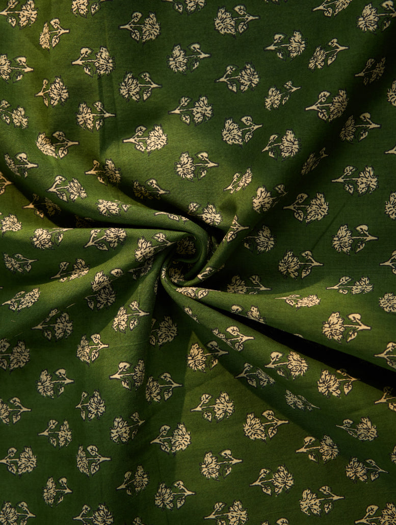 Green fabric with small white floral pattern