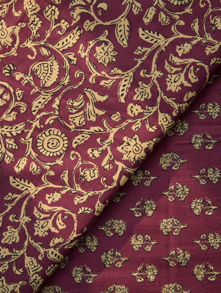 Maroon fabric with gold floral pattern