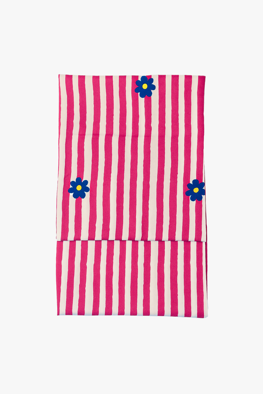 Pink and white striped fabric with blue floral designs on a white background