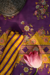 Purple fabric with floral patterns and yellow striped fabric