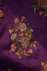 Floral embroidery on purple fabric